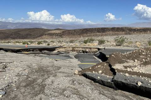 FILE - A damaged section of California Route 190 between Panamint Valley and Towne Pass on Sund ...