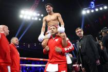Emiliano Fernando Vargas, top, with his father Fernando Vargas, celebrates his knockout win aga ...
