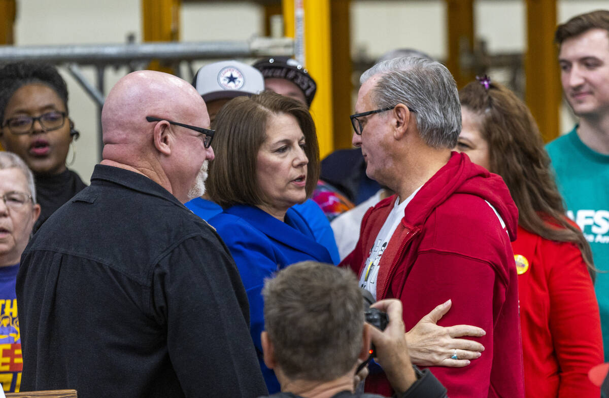 Senator Catherine Cortez Masto talks with her husband Paul after delivering remarks on her hist ...