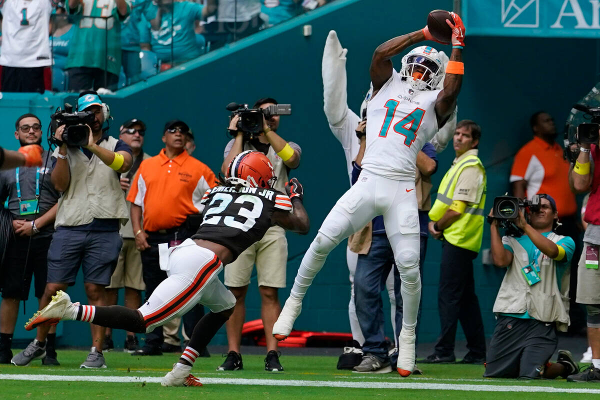 Miami Dolphins wide receiver Trent Sherfield (14) catches a touchdown pass as Cleveland Browns ...