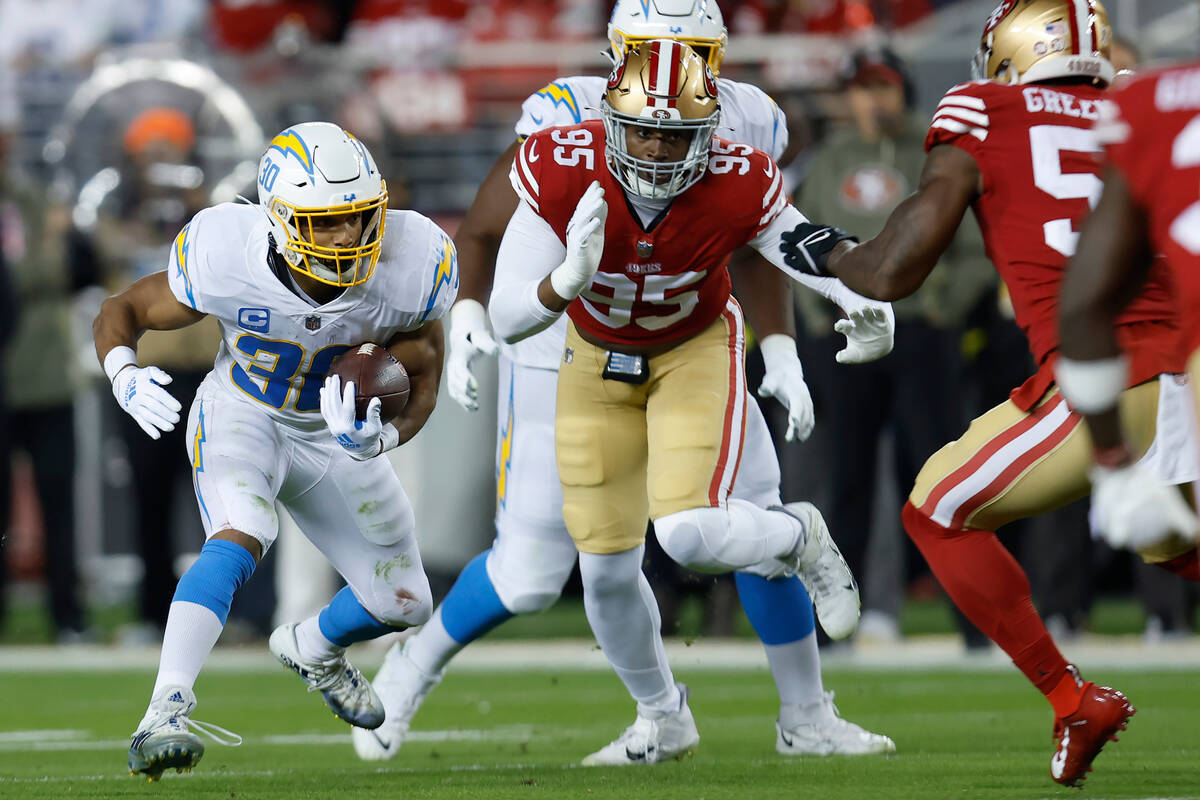 Los Angeles Chargers running back Austin Ekeler (30) runs against the San Francisco 49ers durin ...