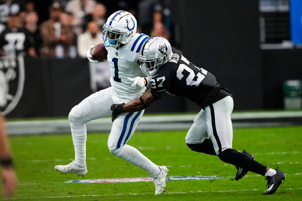 Indianapolis Colts wide receiver Parris Campbell (1) is tackled by Las Vegas Raiders cornerback ...