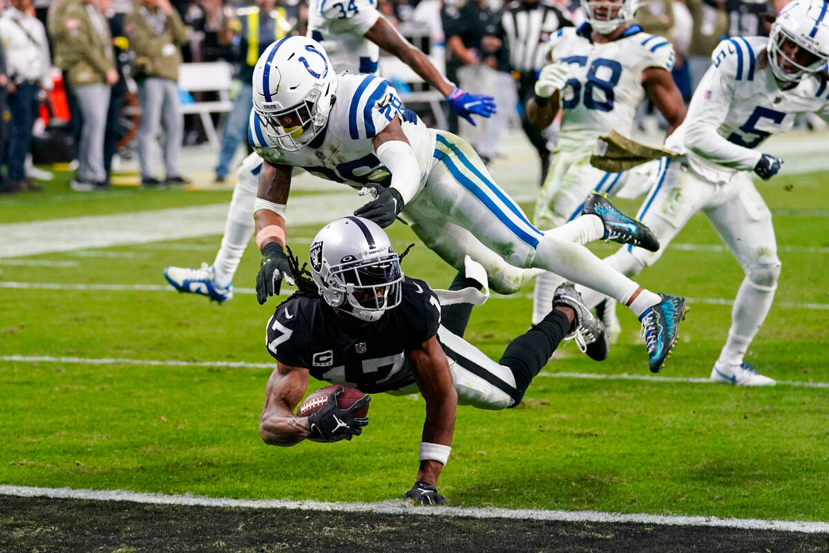 Las Vegas Raiders wide receiver Davante Adams (17) dives for a touchdown in front of Indianapol ...