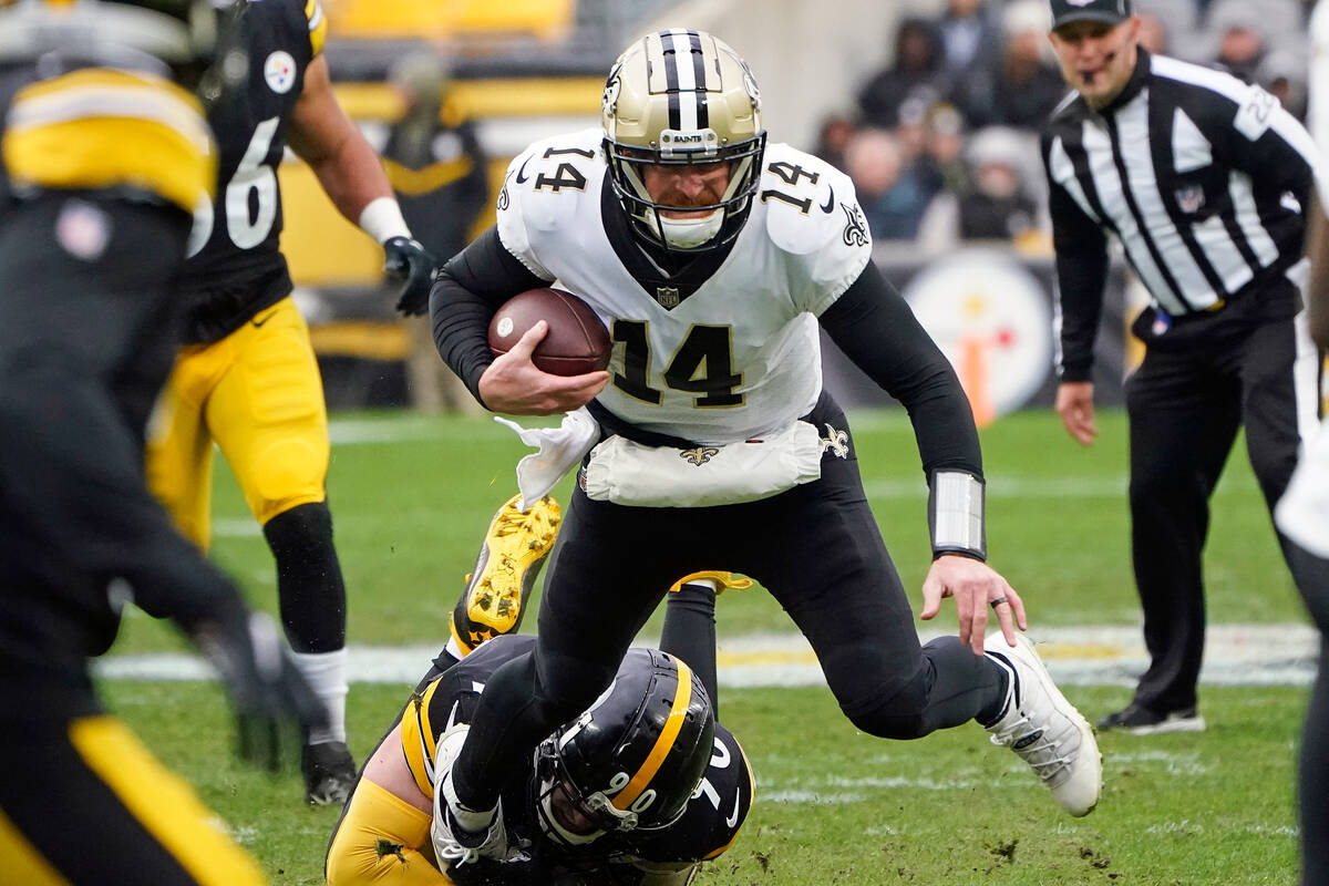 New Orleans Saints quarterback Andy Dalton (14) is sacked by Pittsburgh Steelers linebacker T.J ...