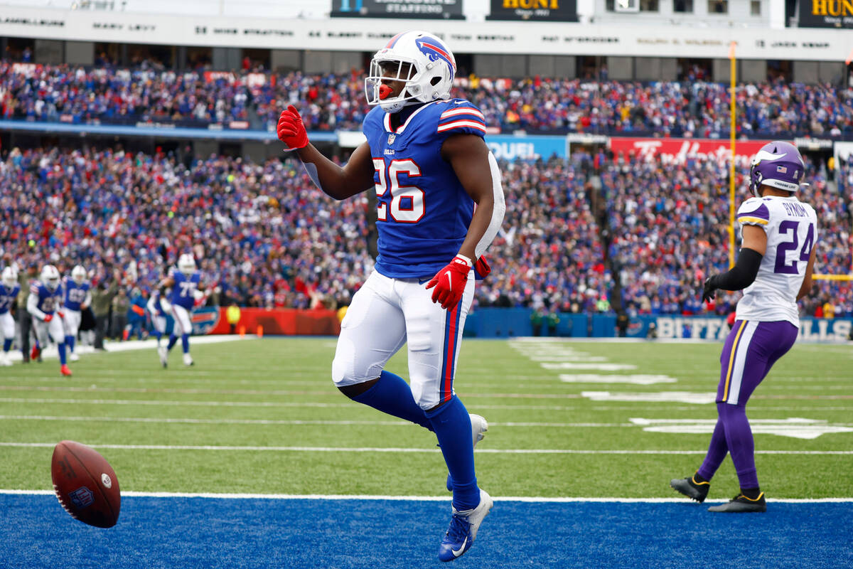 Buffalo Bills running back Devin Singletary (26) celebrates his touchdown in the first half of ...
