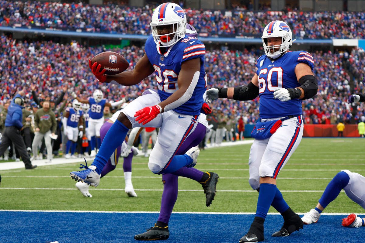 Buffalo Bills running back Devin Singletary (26) celebrates as he runs into the end zone for a ...