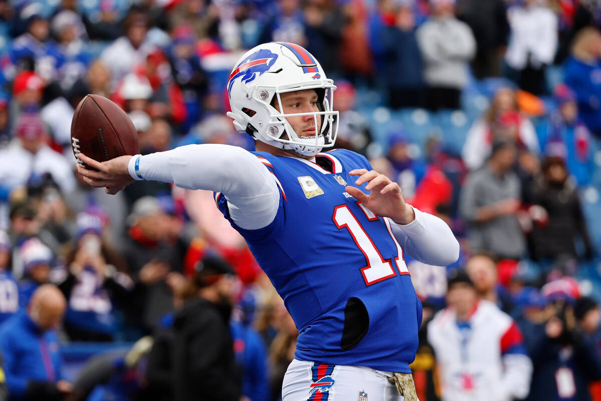 Buffalo Bills quarterback Josh Allen winds up to pass prior to an NFL football game against the ...