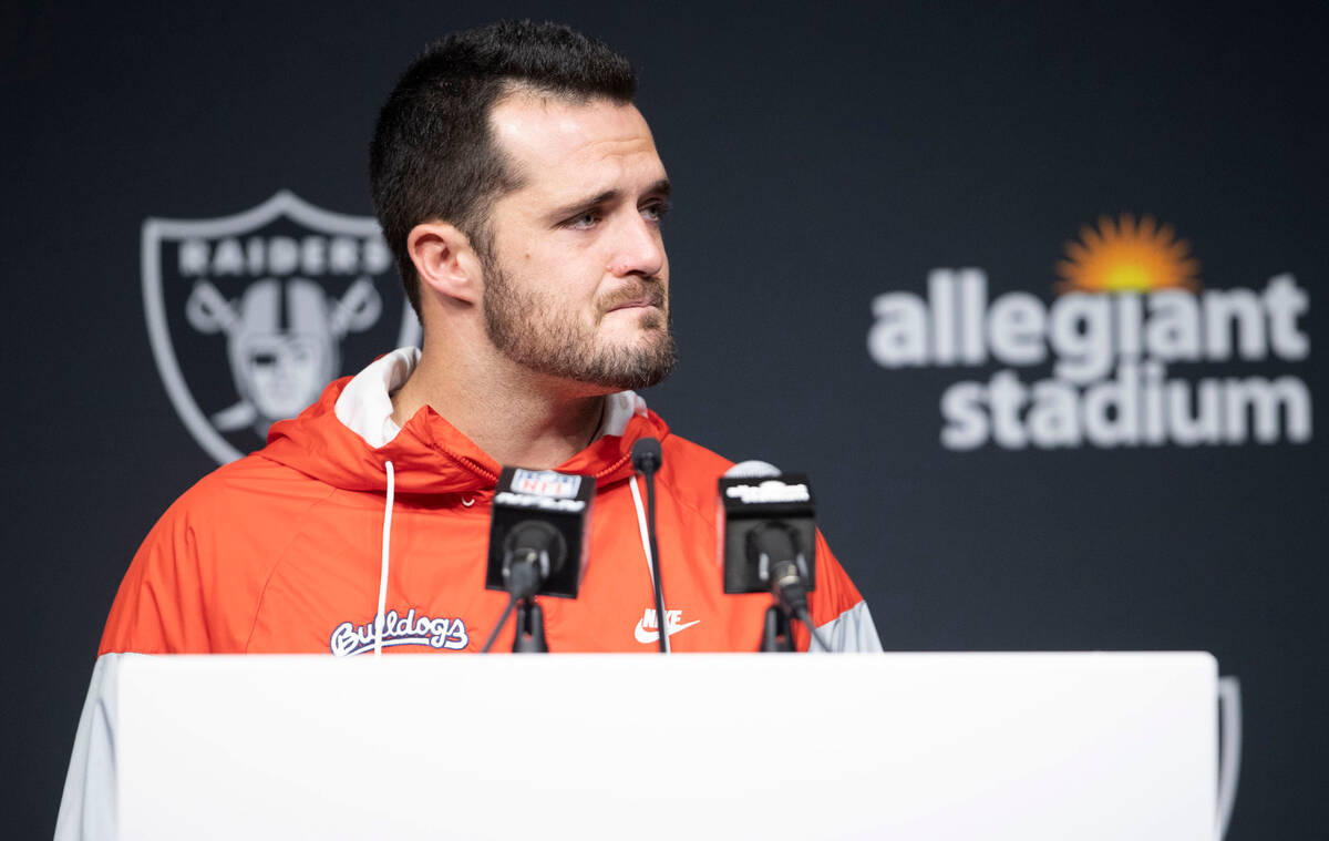Raiders quarterback Derek Carr shows emotion during a post-game news conference following a 25- ...