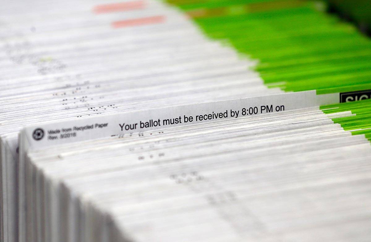 In this Nov. 8, 2016, file photo, ballots are processed at Multnomah County election headquarte ...