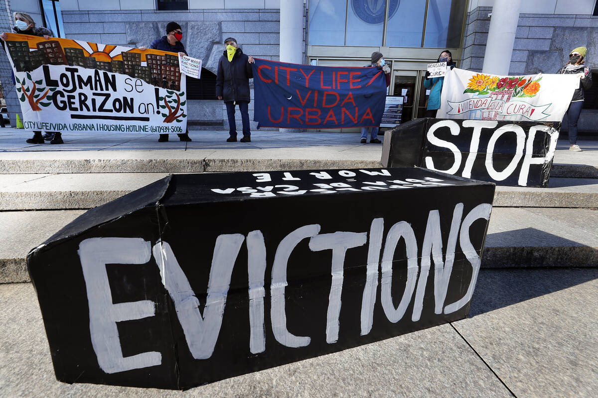 In this Jan. 13, 2021, file photo, tenants' rights advocates demonstrate in front of the Edward ...