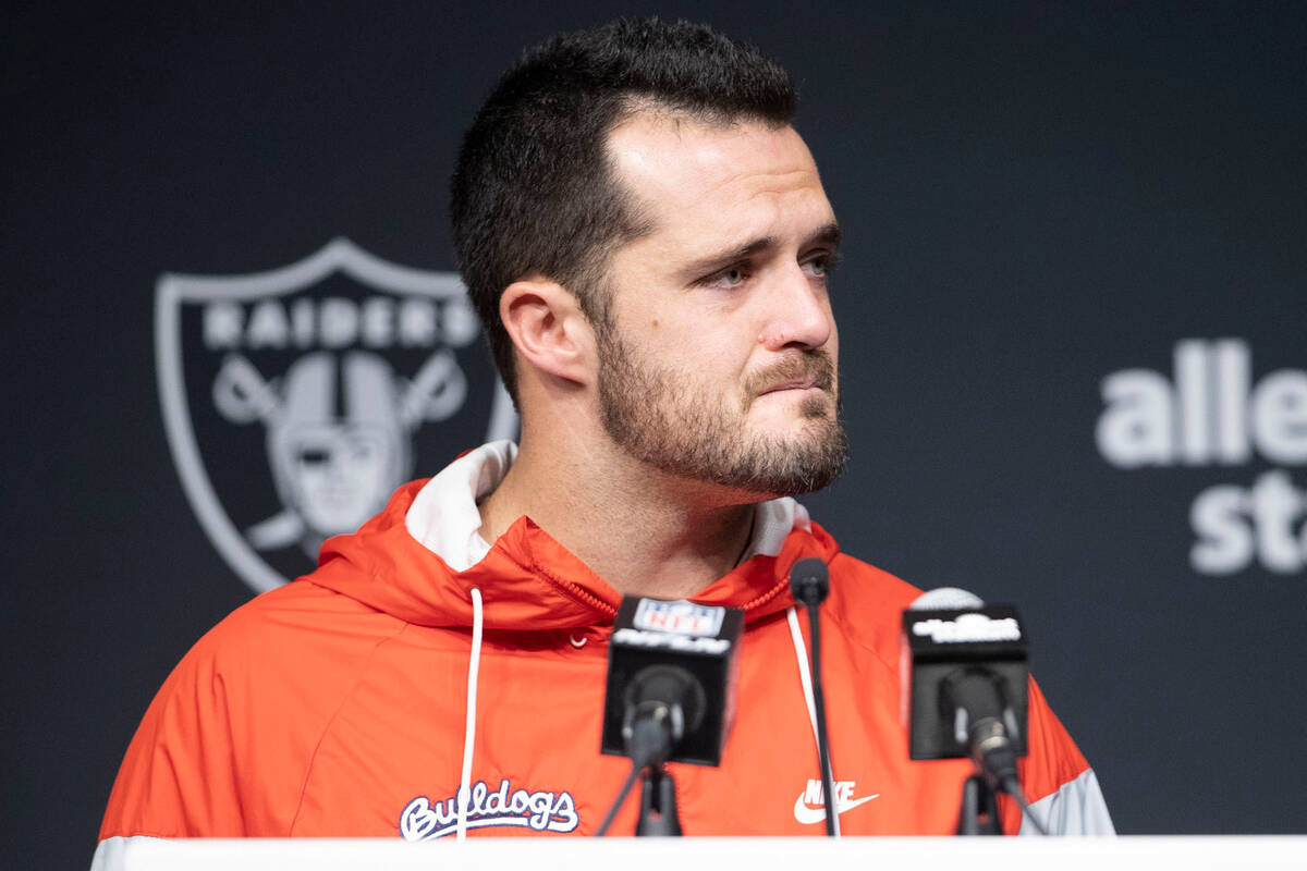 Raiders quarterback Derek Carr shows emotion during a post-game news conference following a 25- ...