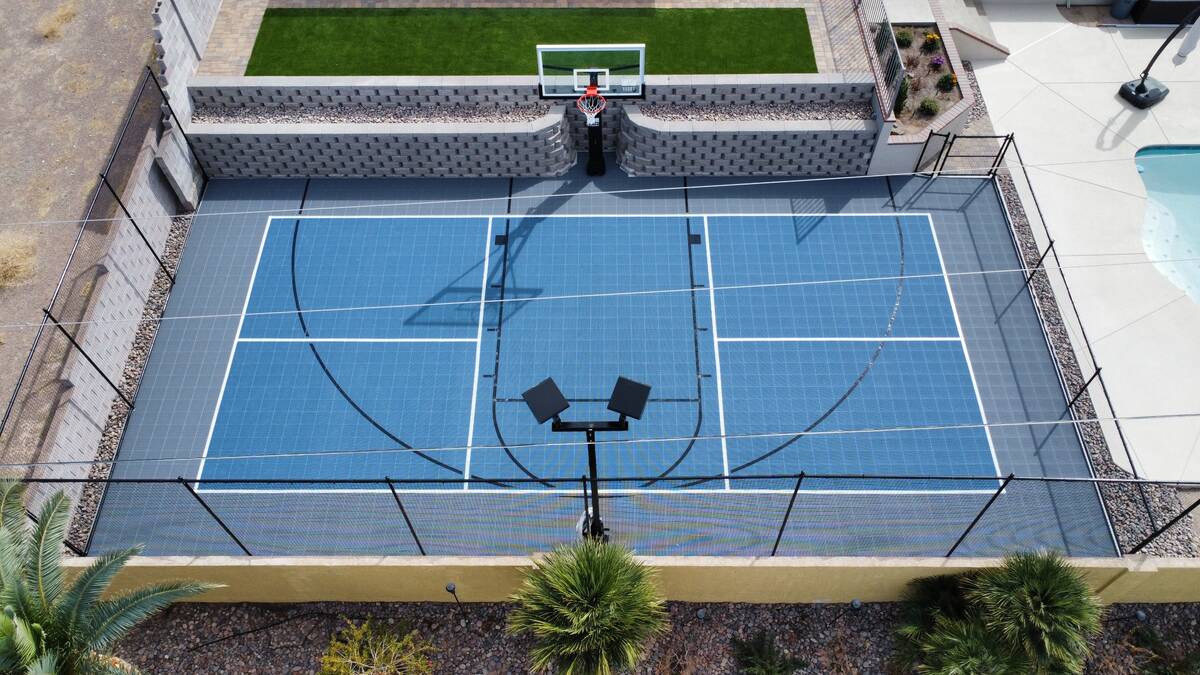 This versatile basketball court can be turned into a pickleball court with the addition of a ne ...