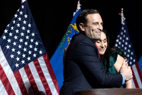 Nevada Republican Senate candidate Senate Adam Laxalt hugs his wife Jaime Laxalt while speaking ...