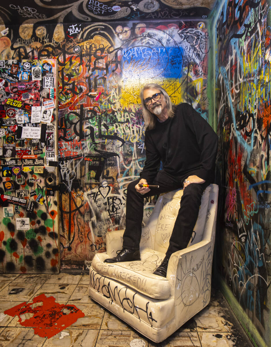 P Moss, owner of the Double Down Saloon, poses for a portrait in one of the bathrooms at the le ...