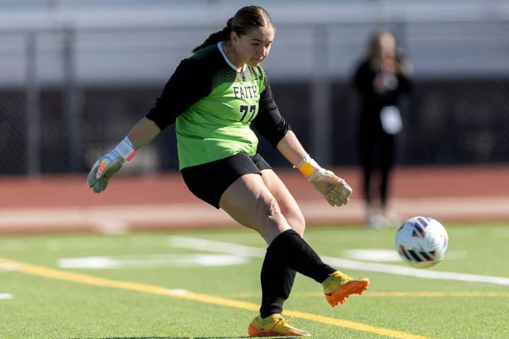 Faith Lutheran’s goalkeeper Elke Travis (77) kicks the ball back into play during a Clas ...