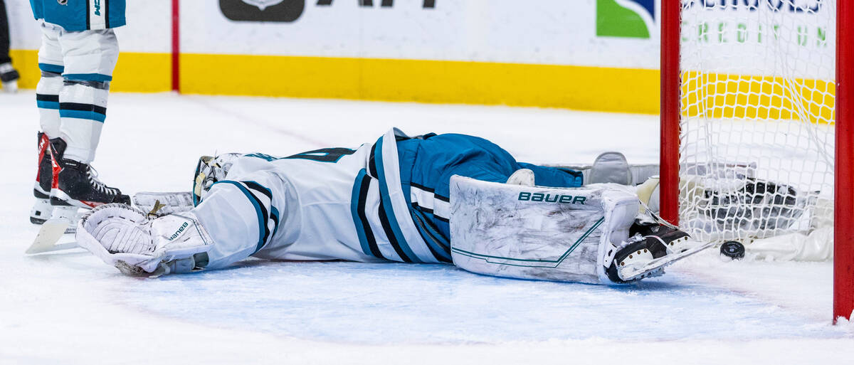 San Jose Sharks goaltender James Reimer (47) is flat out on the ice as the puck goes into the n ...