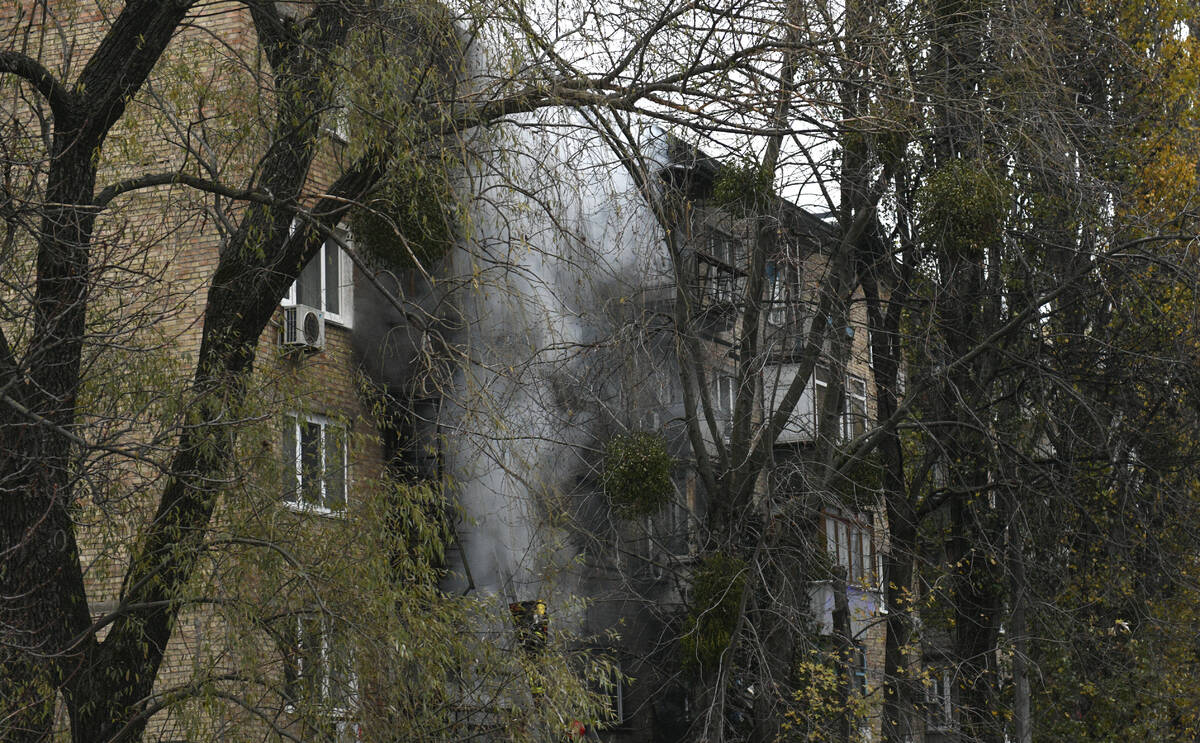 A damaged building seen at the scene of Russian shelling in Kyiv, Ukraine, Tuesday, Nov. 15, 20 ...
