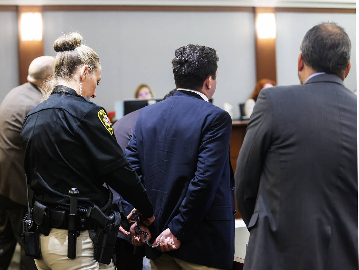 Joshua Buckingham is cuffed after being sentenced for a reckless driving charge for killing Ran ...