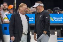 Raiders owner Mark Davis, left, and head coach Josh McDaniels share moment before an NFL game a ...