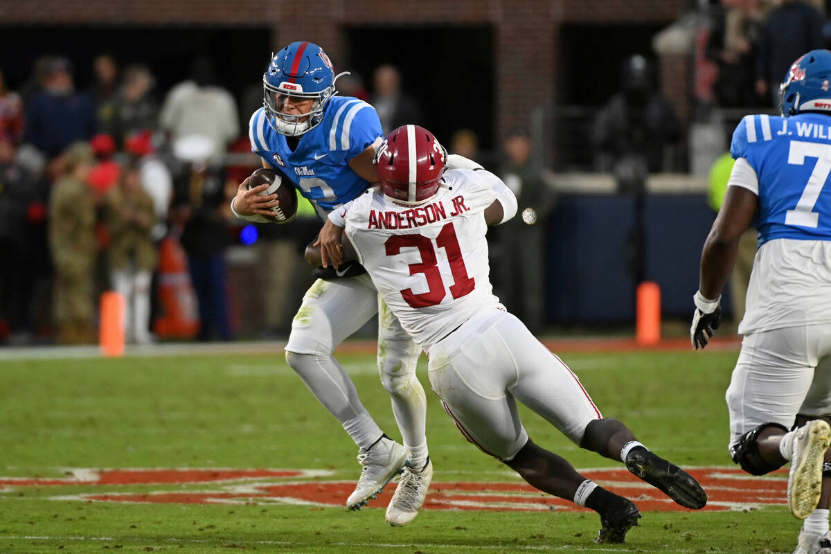 Alabama linebacker Will Anderson Jr. (31) tackles Mississippi quarterback Jaxson Dart during th ...
