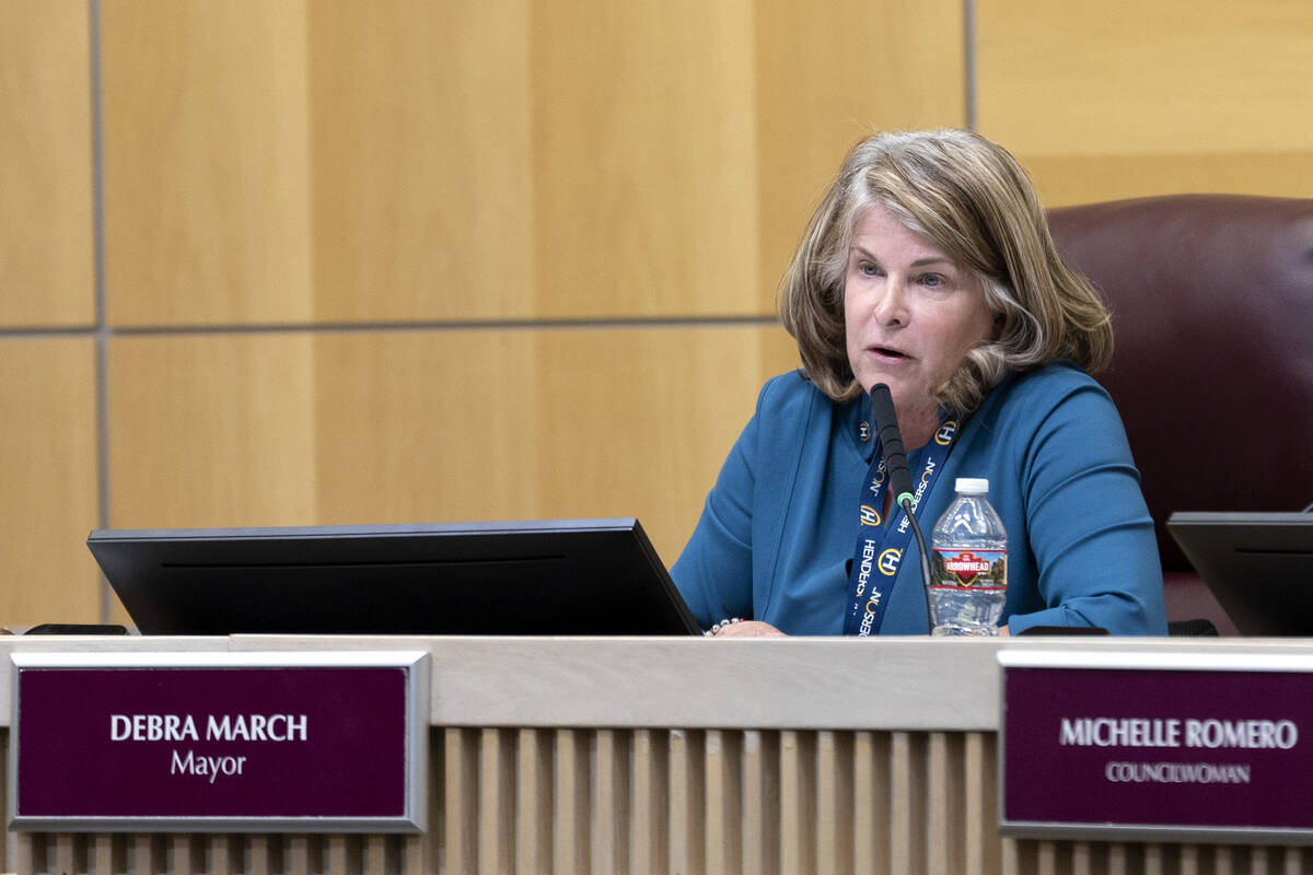 Henderson Mayor Debra March listens to public commentary during a city council hearing at Hende ...