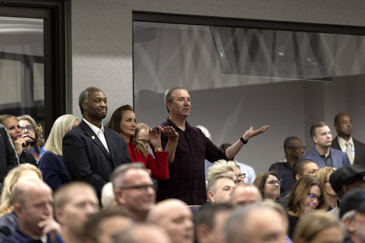 An attendee reacts to public commentary during a city council hearing at Henderson City Hall on ...
