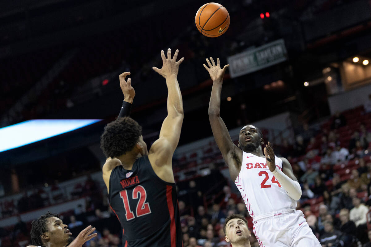 Dayton Flyers guard Kobe Elvis (24) shoots against UNLV Rebels center David Muoka (12) during t ...