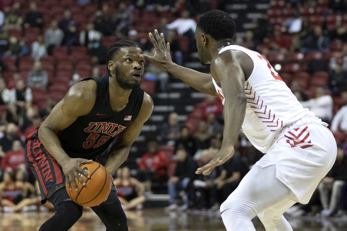 Dayton Flyers forward R.J. Blakney (23) puts pressure on UNLV Rebels guard EJ Harkless (55) dur ...