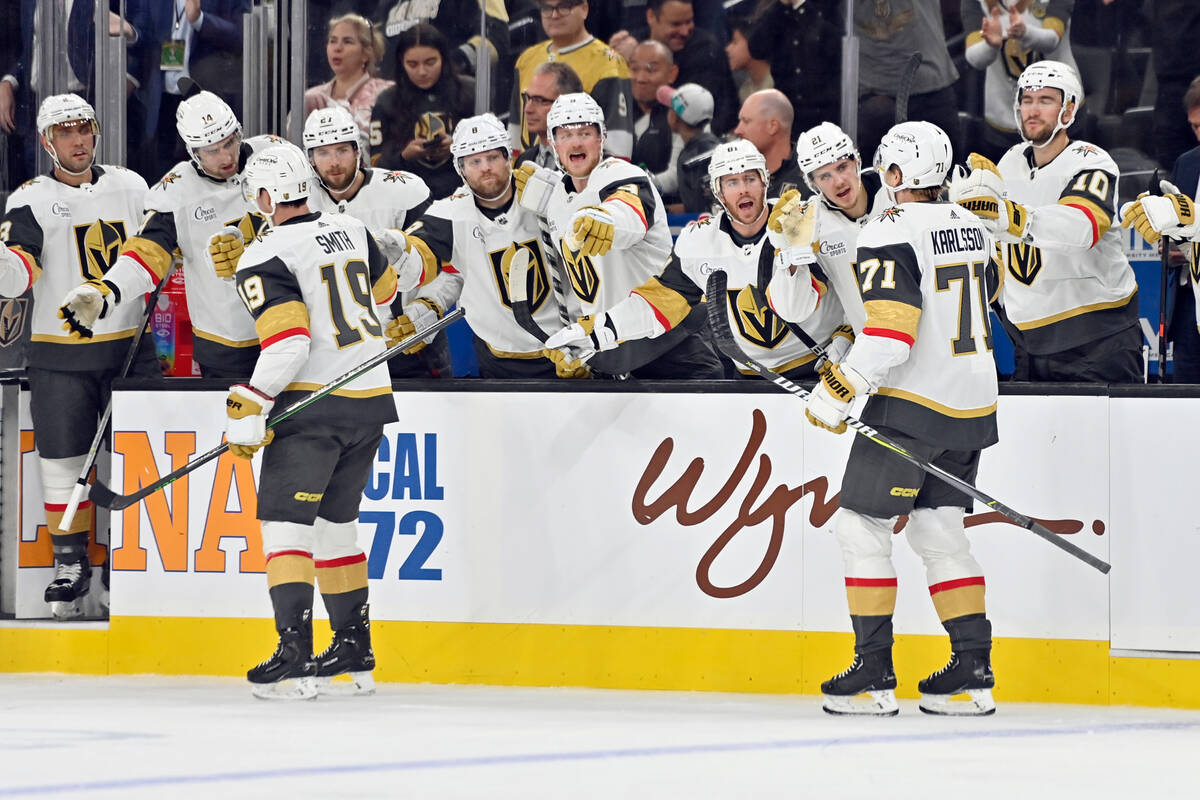 The Vegas Golden Knights bench celebrates a right wing Reilly Smith's (19) goal against the Ana ...