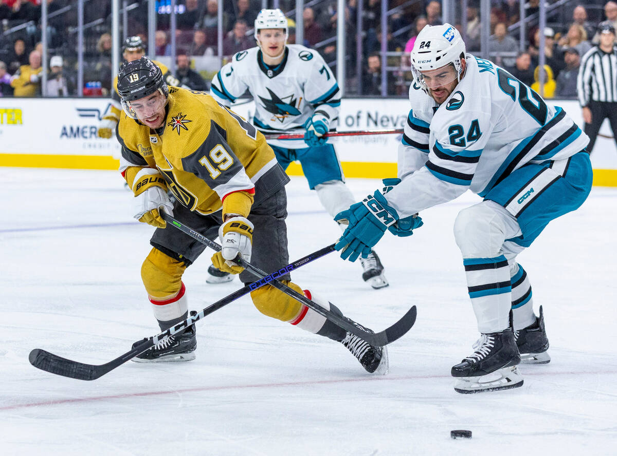 Golden Knights right wing Reilly Smith (19) eyes the puck with San Jose Sharks defenseman Jayco ...