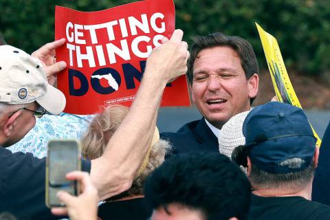 Florida Governor Ron DeSantis greets supporters during a rally at Freedom Park in the Solivita ...