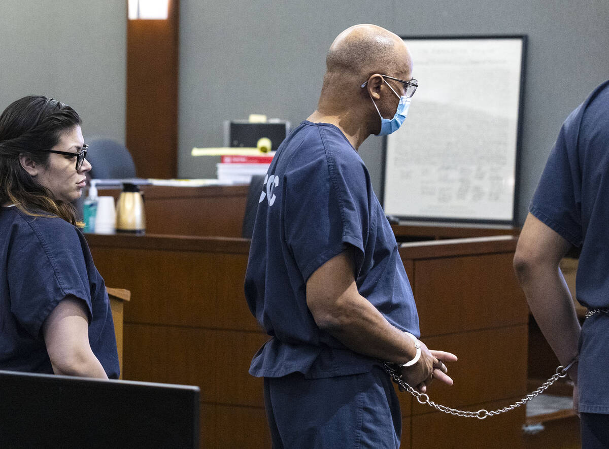 Wendell Melton, right, who was found guilty of killing his 14-year-old son in 2017, led into th ...