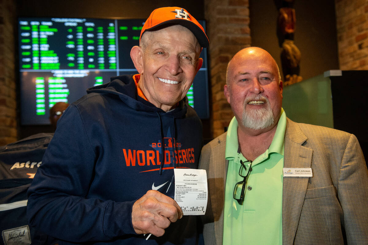 Jim McIngvale, better known as "Mattress Mack," poses with Carl Johnson, sportsbook m ...