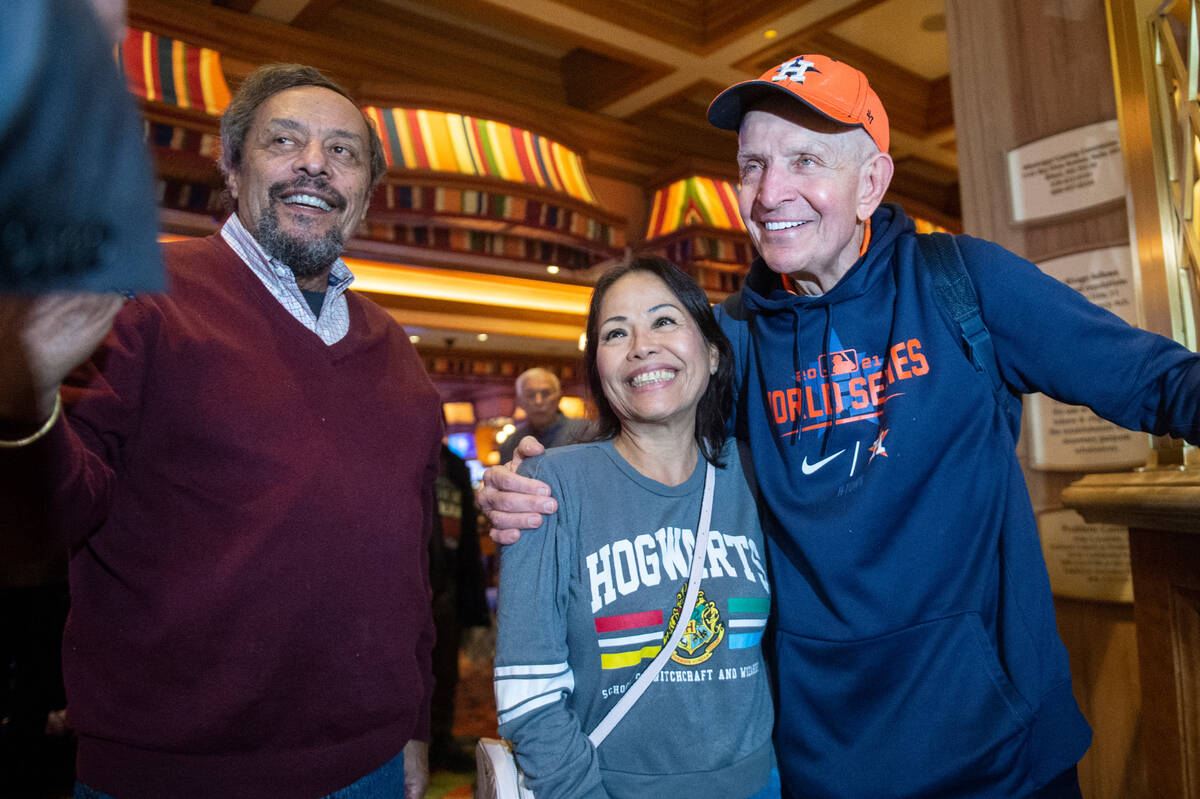 Jim McIngvale, better known as "Mattress Mack," poses for photos with fans as he walk ...