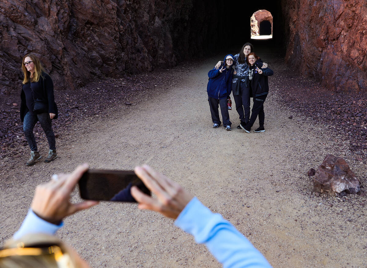 Students Jayden Zimmerman, 17, left, her bother Alex Zimmerman, 15, center, and their mother, J ...