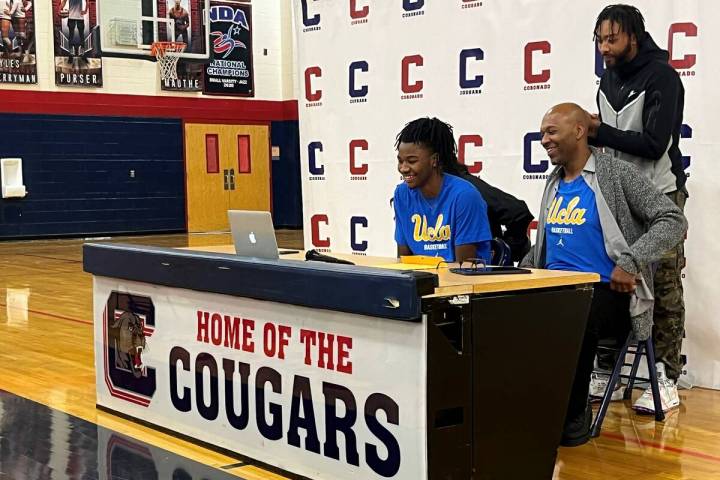 Coronado guard Sebastian Mack smiles with his family by his side after announcing his commitmen ...