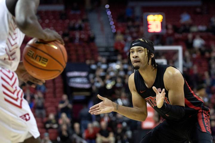 UNLV Rebels guard Justin Webster (2) claps while defending against Dayton Flyers guard Kobe Elv ...