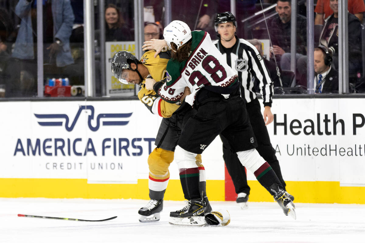 Golden Knights right wing Keegan Kolesar (55) and Coyotes center Liam O'Brien (38) fight during ...
