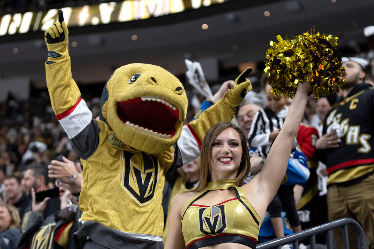 The Golden Knights mascot Chance and a Vegas Viva celebrate a goal during the third period of a ...