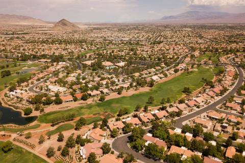 An aerial image shows homes and a golf course in the Summerlin community as some homeowner asso ...