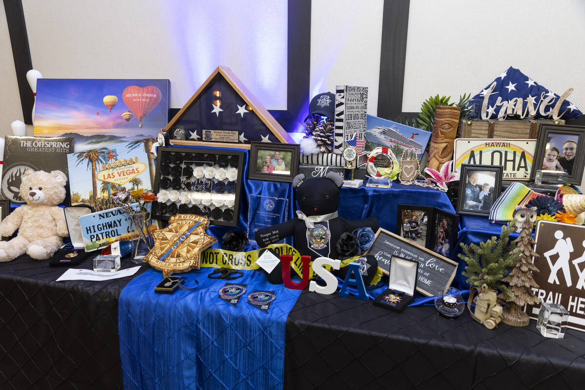 Photographs and other May family belongings are displayed during an unveiling event of a florag ...