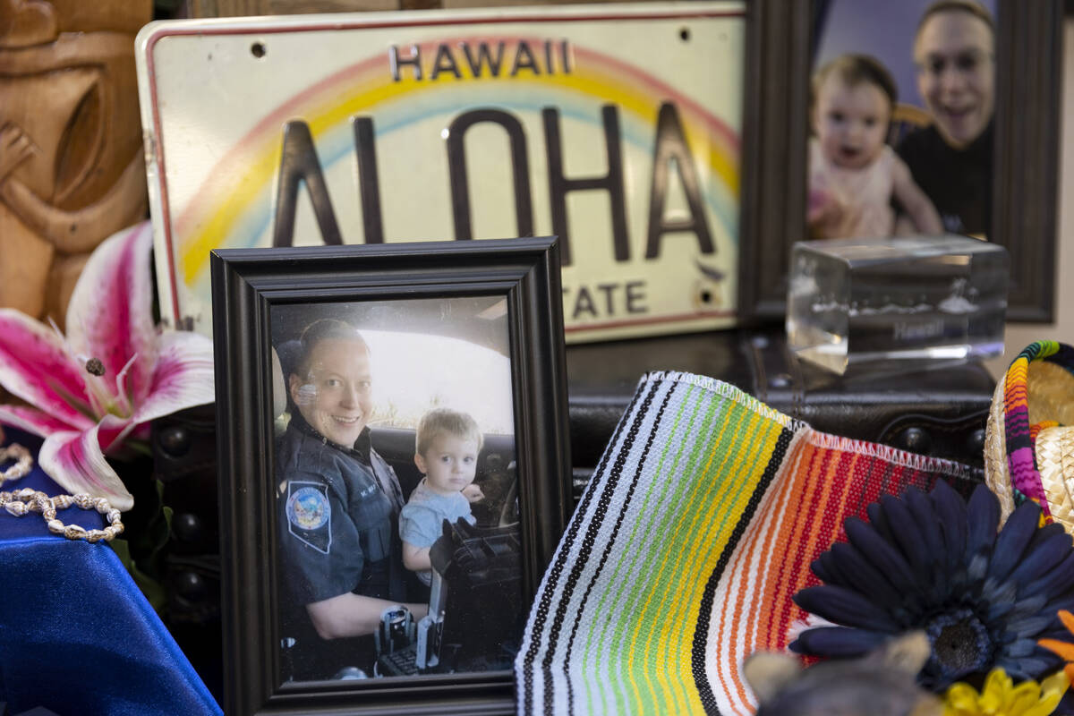 Photographs and other May family belongings are displayed during an unveiling event of a florag ...