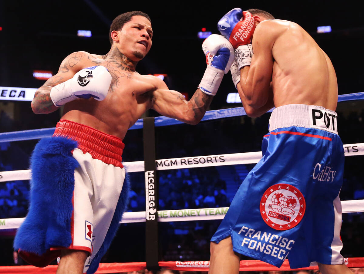 Gervonta Davis, left, throws a punch against Francisco Fonseca in the 5th round on Saturday, Au ...