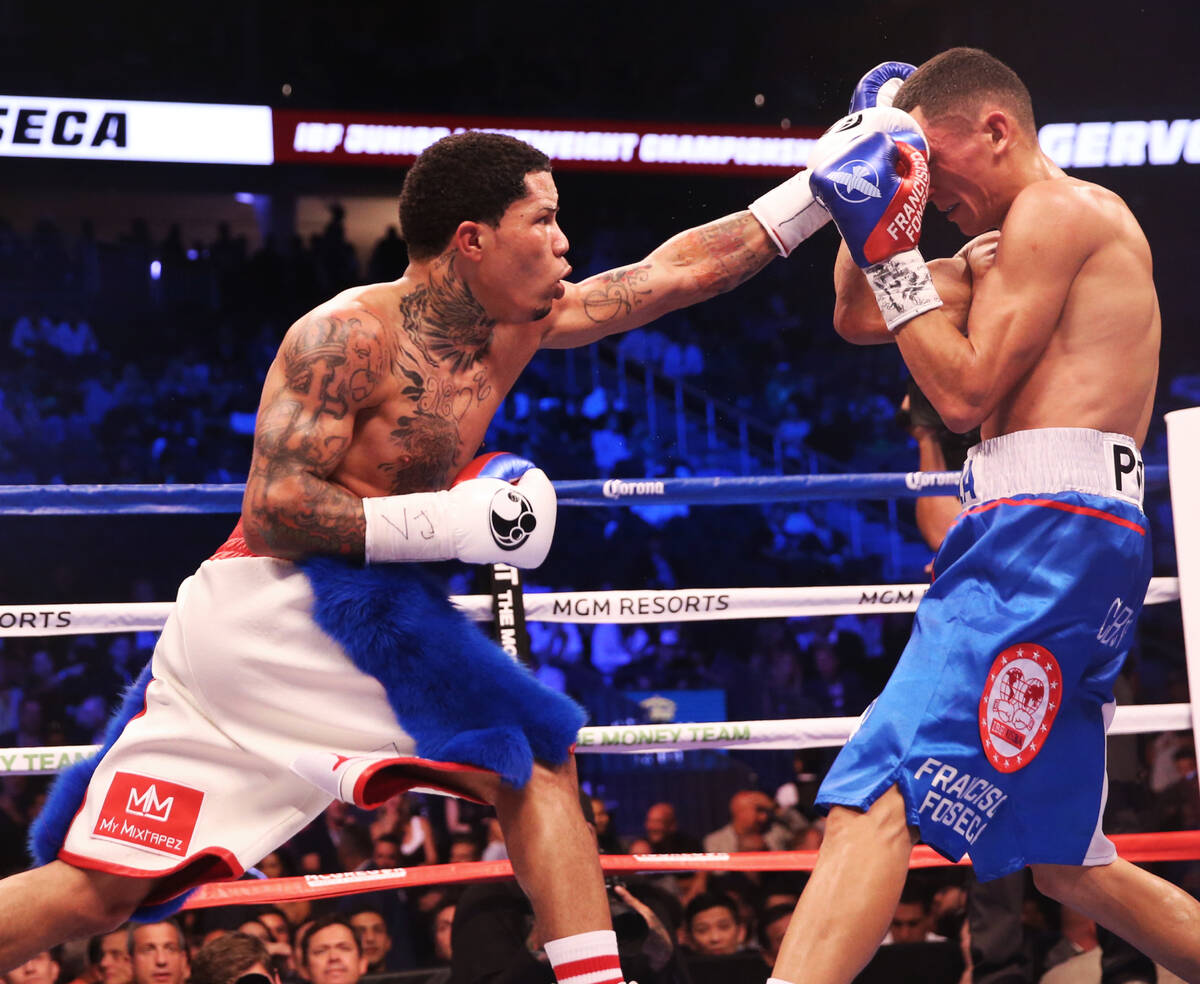 Gervonta Davis, left, throws a punch against Francisco Fonseca in the 8th round on Saturday, Au ...