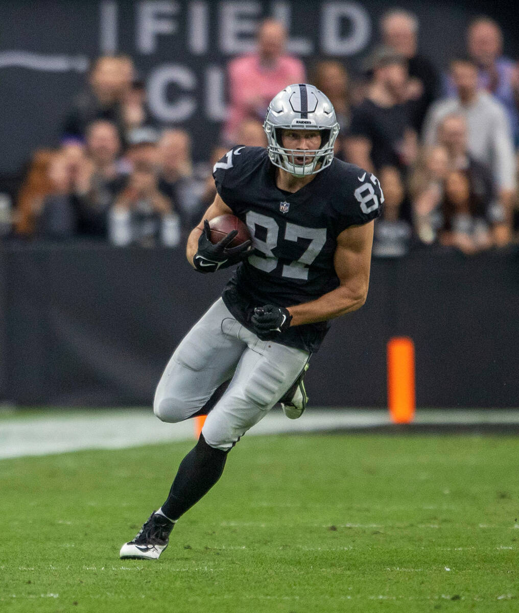 Raiders tight end Foster Moreau (87) runs after making a catch during the first half of an NFL ...