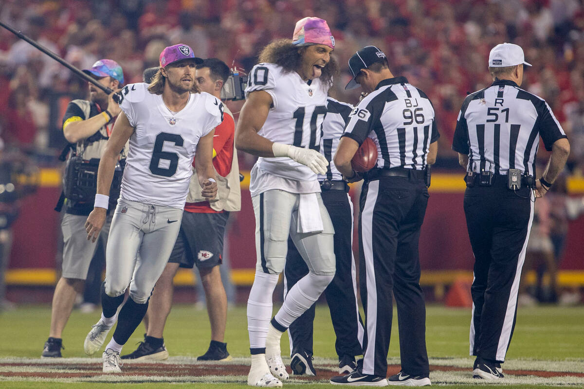 Raiders wide receiver Mack Hollins (10) reacts after calling the coin toss with punter AJ Cole ...