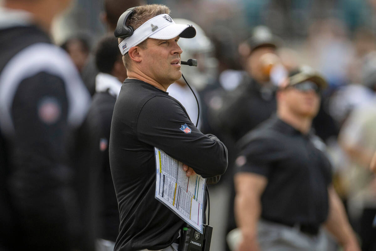 Raiders head coach Josh McDaniels looks on from the sideline during the first half of an NFL ga ...