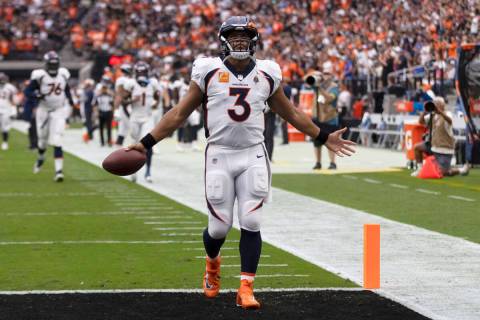 Denver Broncos quarterback Russell Wilson (3) gestures as he comes to the end zone before an NF ...