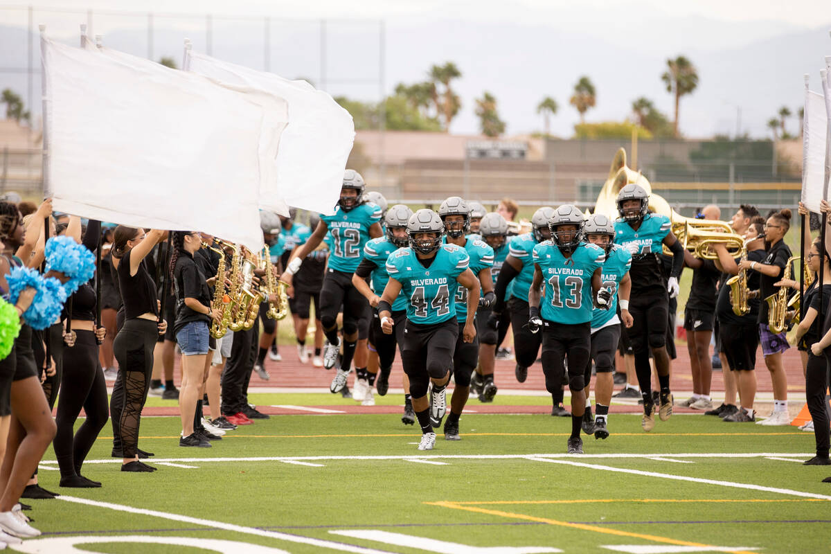 Silverado High School football team runs out onto the field as they host Sierra Vista on Friday ...
