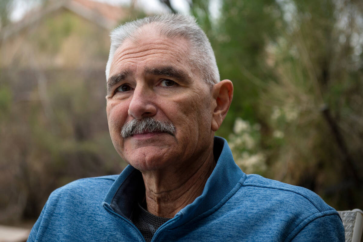 Jim Bolla, former UNLV women's basketball coach, poses for a photograph outside of his home in ...